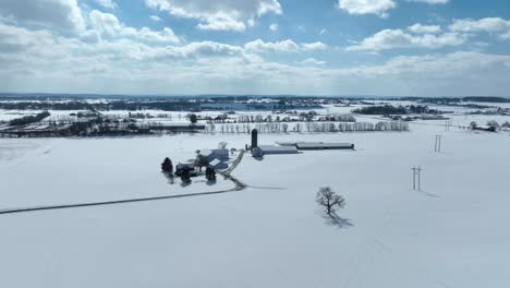 Rural-farmland-covered-in-snow-on-sunny-winter-day