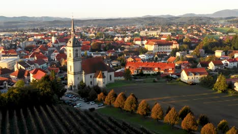 aerial panorama view of small medieval european town slovenska bistrica, slovenia with church and castle in sunrise