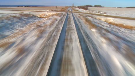 Time-Lapse-Pov-Desde-La-Parte-Delantera-De-Un-Tren-Que-Pasa-Por-Un-Paisaje-Nevado-1