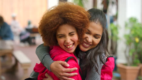 cheerful best friends embracing