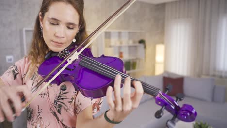 musician woman performing her art at home.