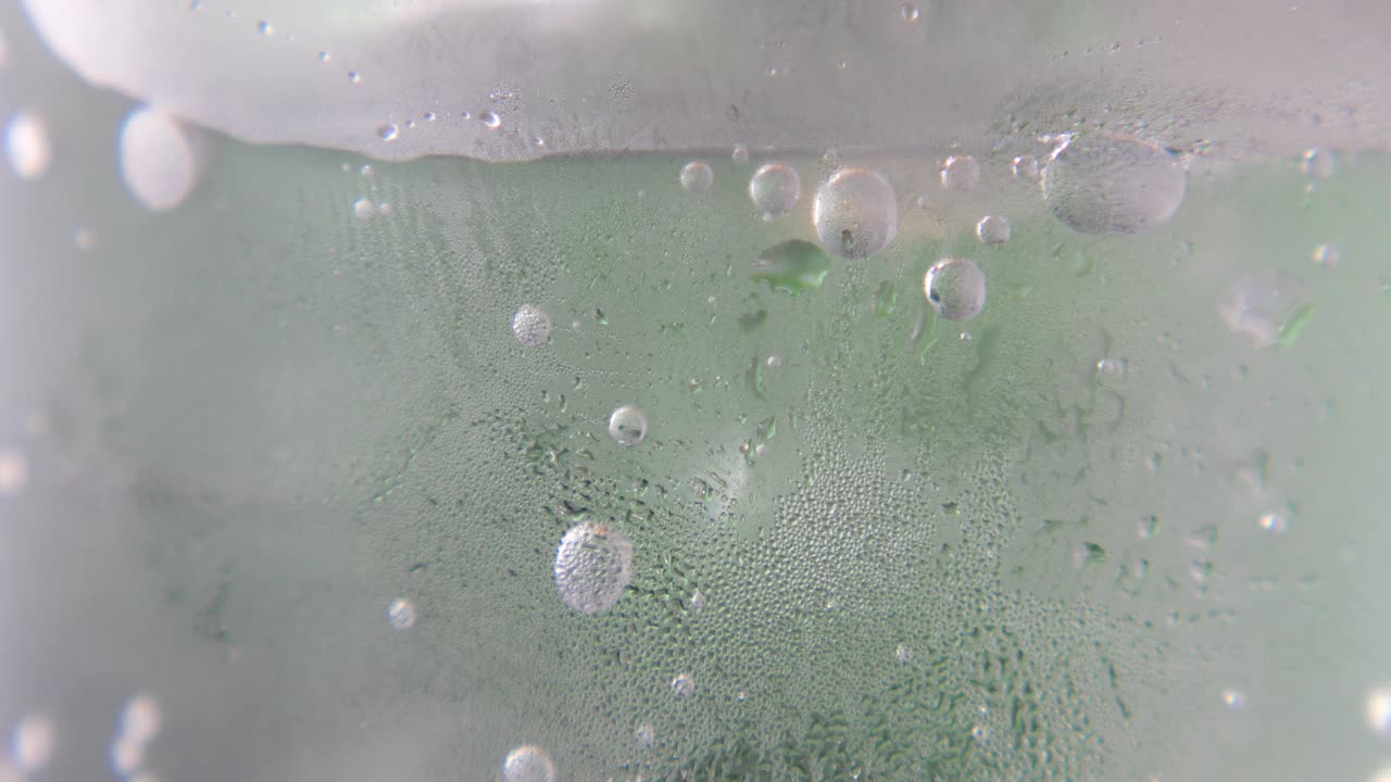 Close-up of Condensation and Bubbles on Glass