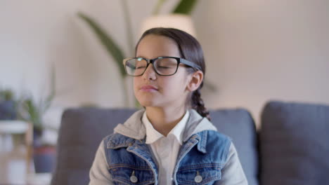 portrait shot of cute hispanic girl in glasses