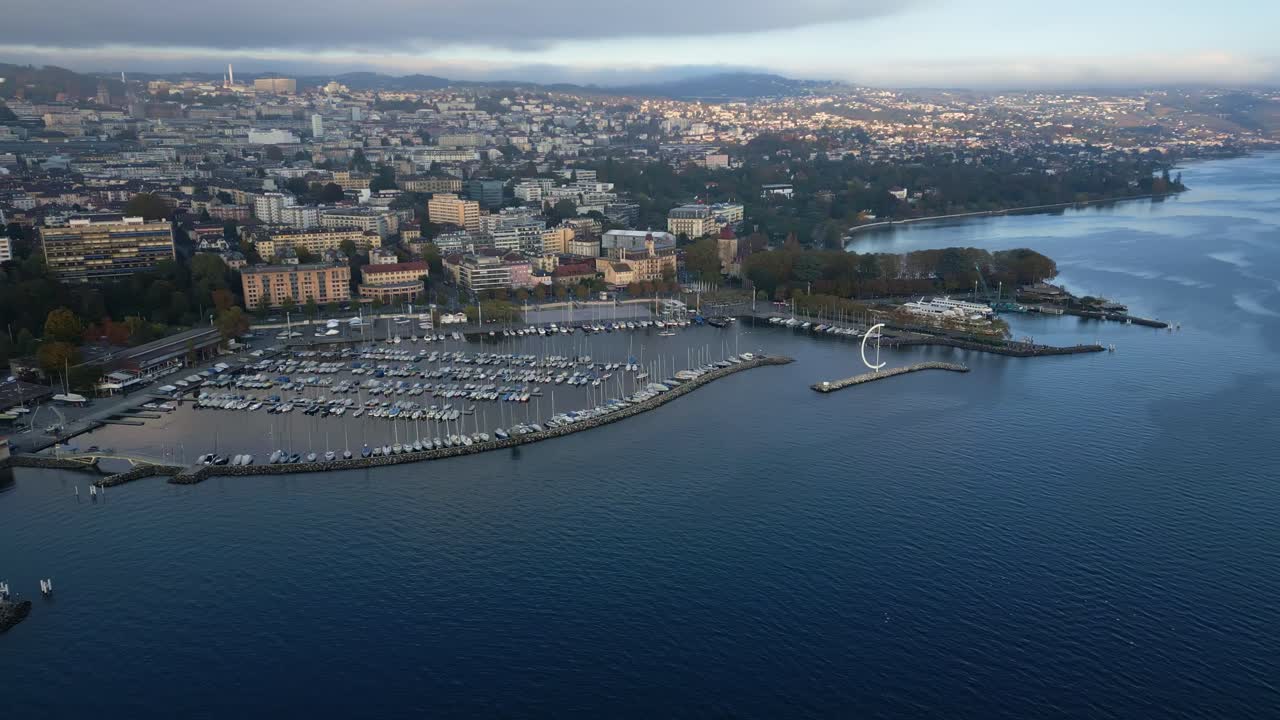 Parallax drone shot of Ouchy Port at sunset in Lausanne Switzerland
