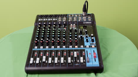 audiomixer in front of chroma green