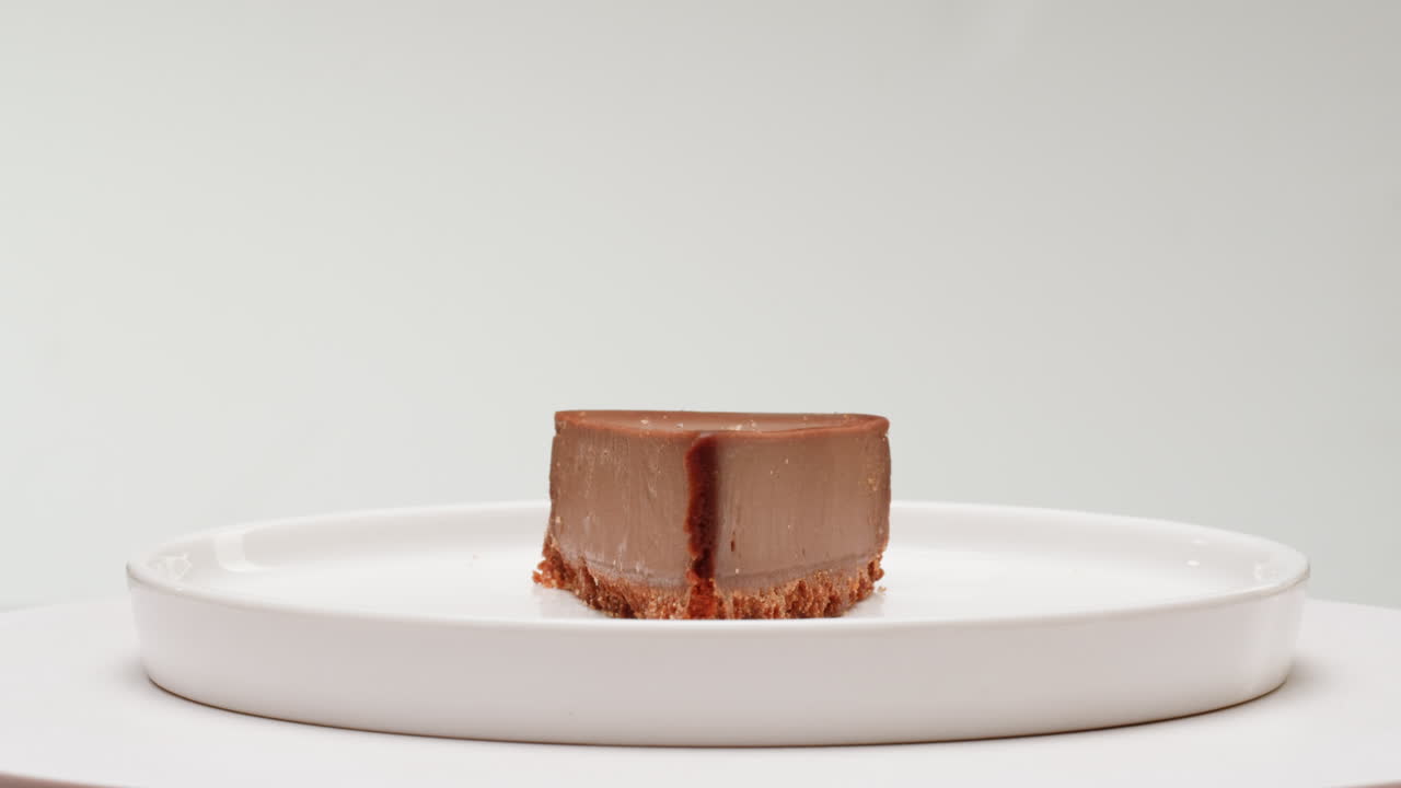 Chocolate Cheesecake Slice on a White Plate
