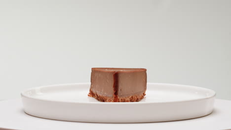 chocolate cheesecake slice on a white plate