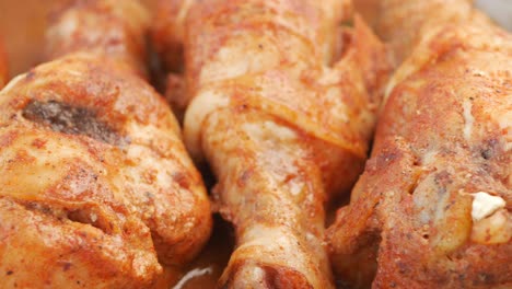 close up of roasted chicken drumsticks