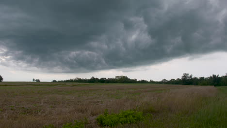 Timelapse-of-a-storm-front-moving-in-over-farm-fields