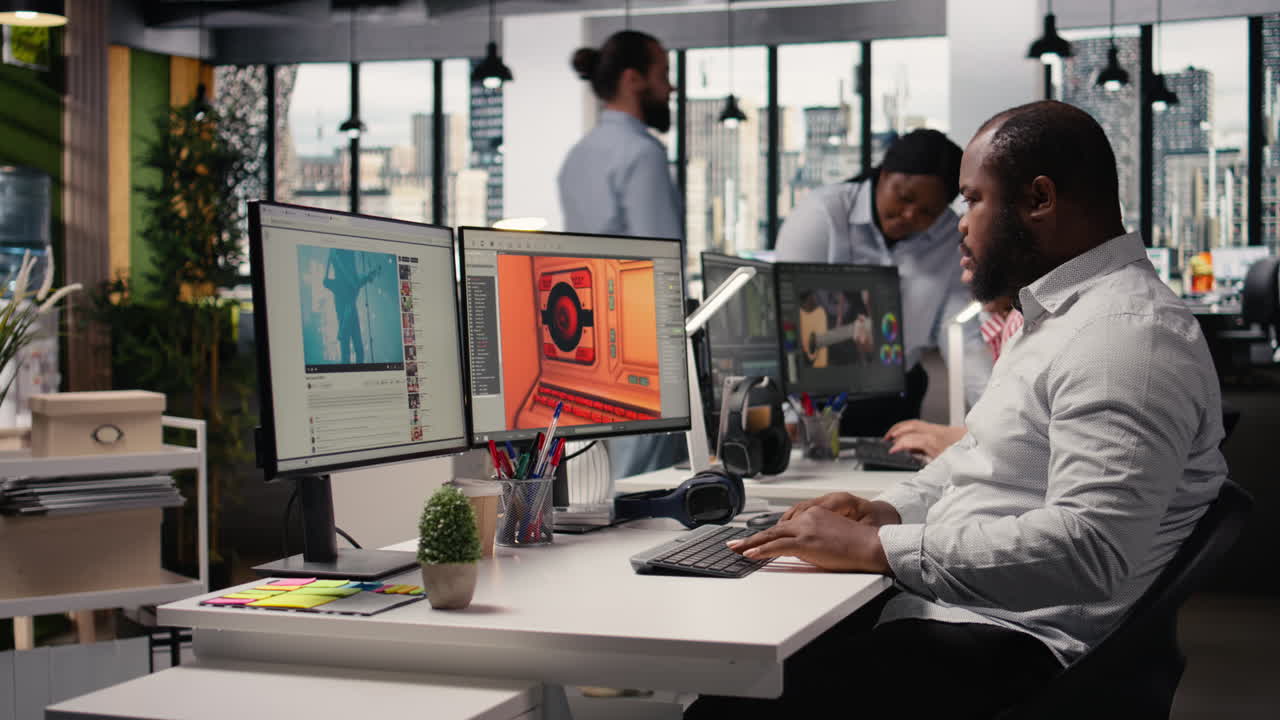 Black male game developer creating futuristic space video game
