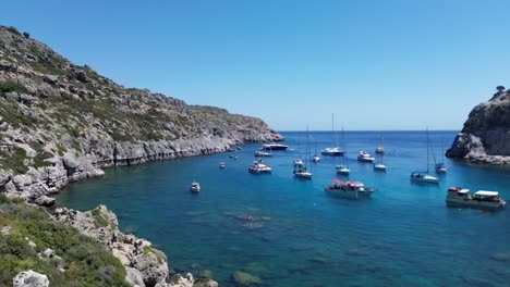 anthony quinn bay in faliraki, rhodes in greece during the day with crystal clear water