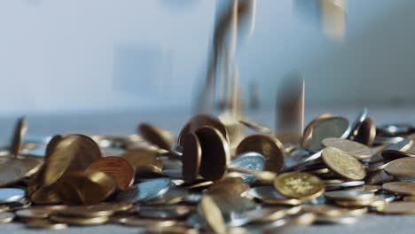 closeup slow motion dropping coins