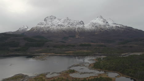 beautiful norwegian landscape with snow capped mountains and fjords