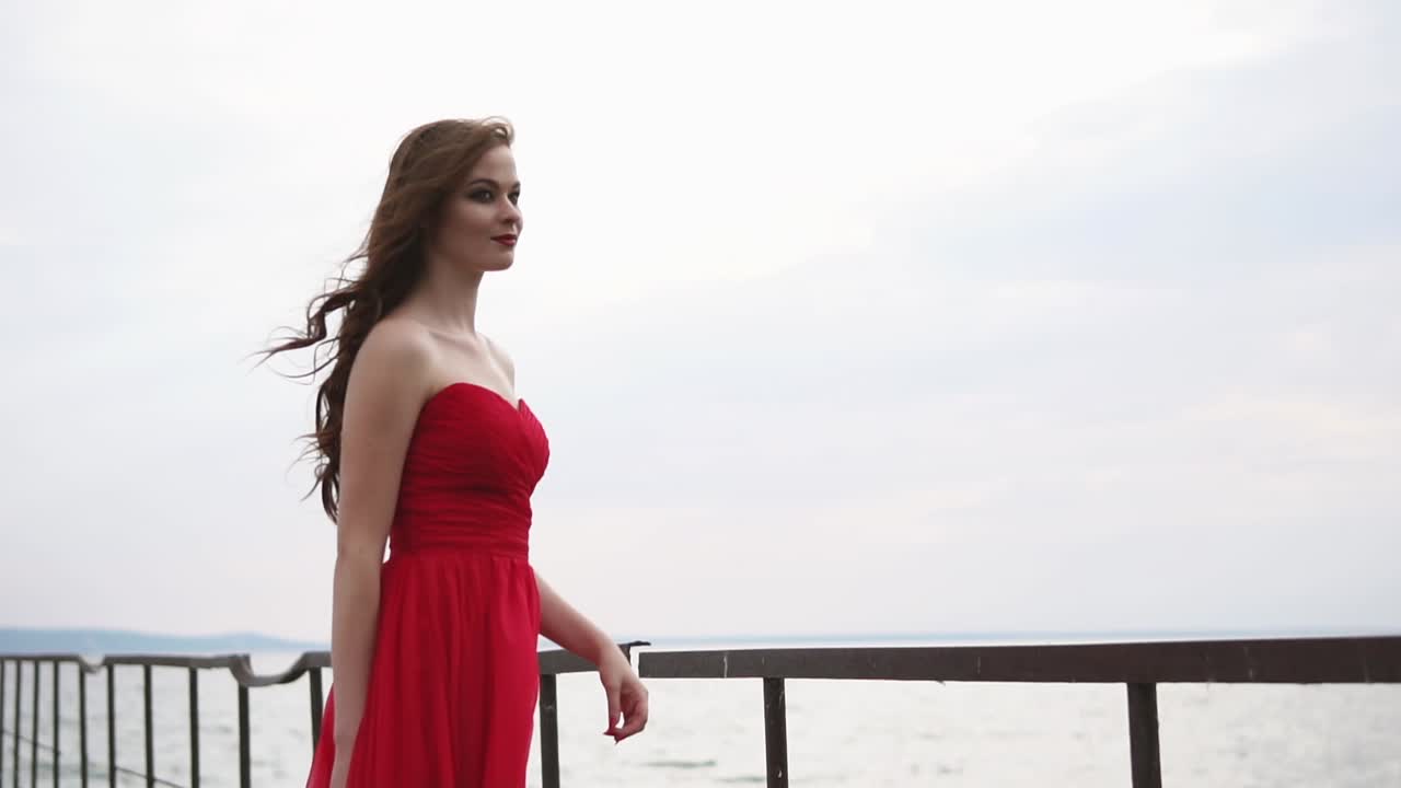 Woman in Red Dress by the Lake