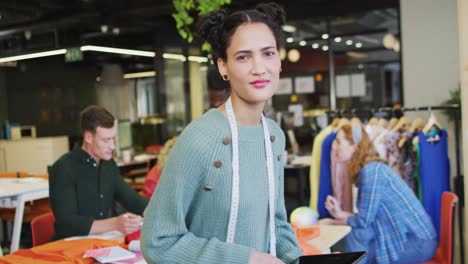 portrait of happy caucasian businesswoman looking at camera at office