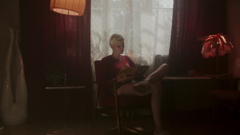 woman reading in retro interior