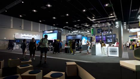 wide view of the bustling exhibition hall at ifa berlin, showcasing the latest in consumer and home electronics, with visitors exploring the various displays and booths.