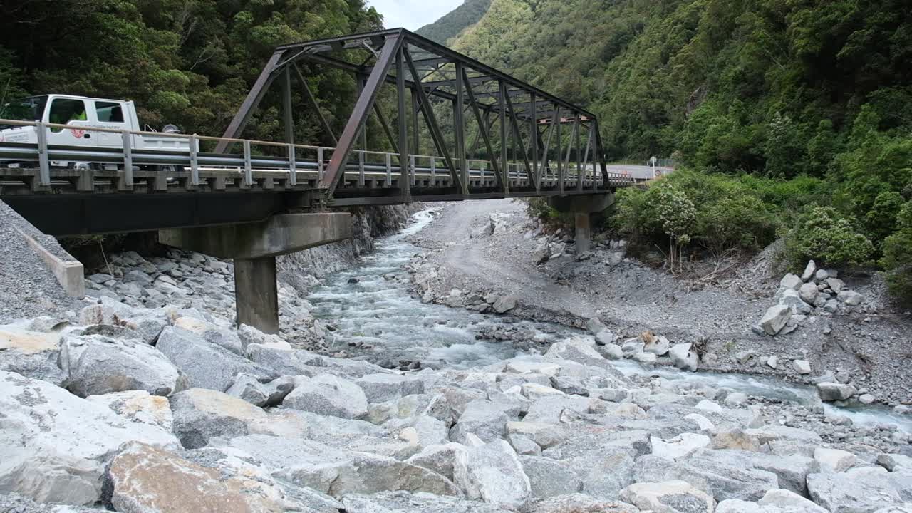 cars travelling over a Bailey Bridge in the southern Alps of New Zealand