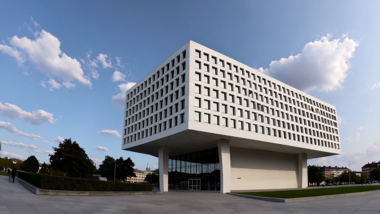 Modern White Building with Geometric Design and Glass Facade