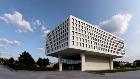 modern white building with geometric design and glass facade