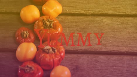 animation of yummy text over vegetables