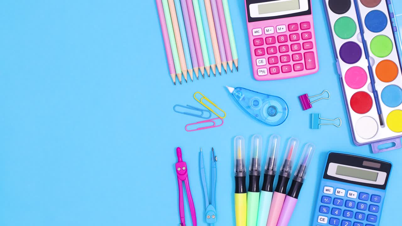 Pastel back to school accessories appear on right side of pastel blue theme and open notebook for text on left . Stop motion