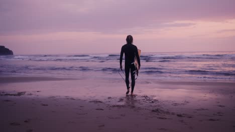 surfer at sunset beach