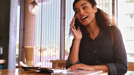 smiling woman talking on mobile phone