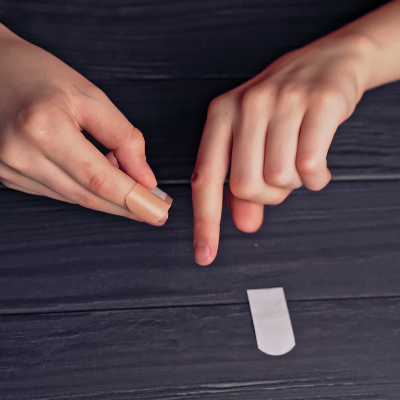Plaster on children's hand. Giving first aid