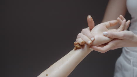 woman receiving a hand and arm scrub