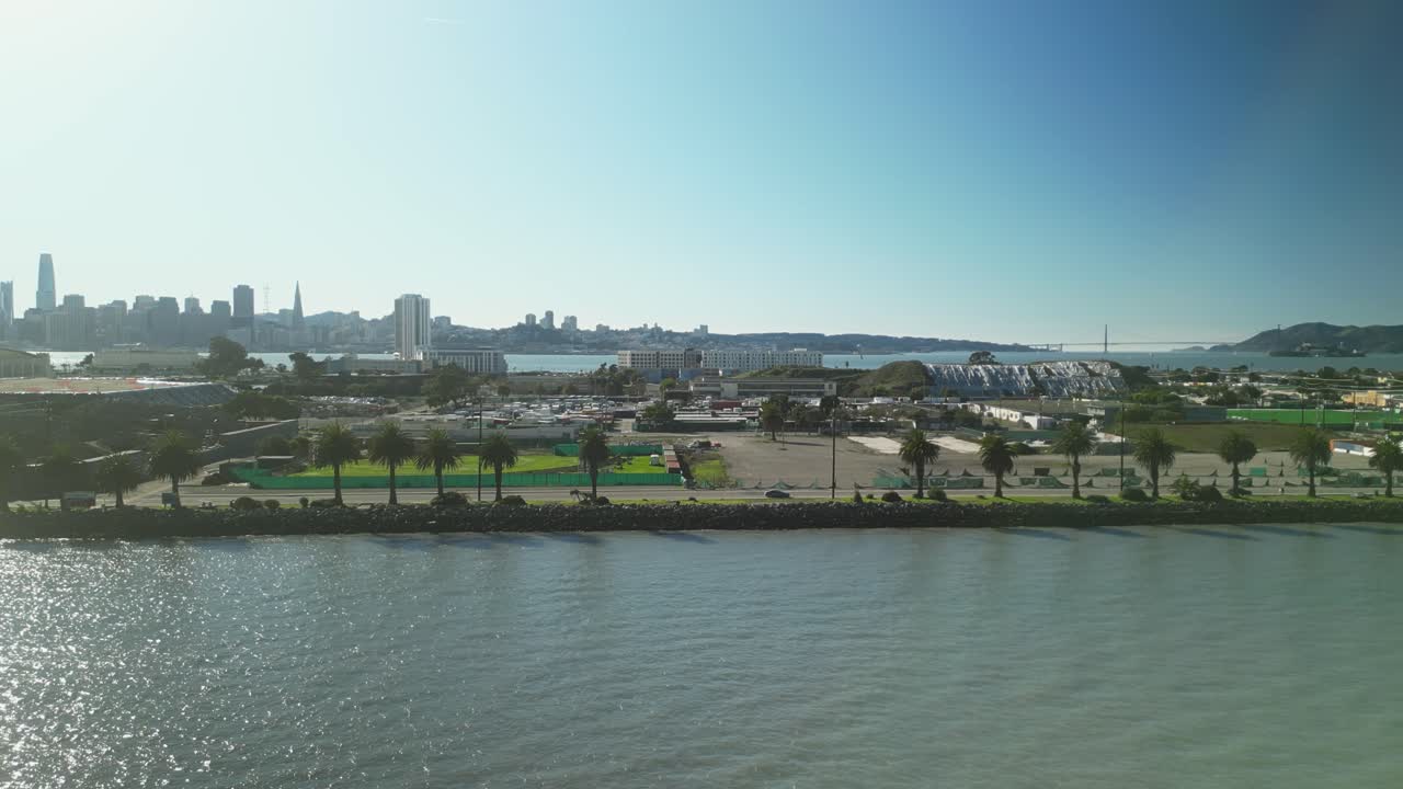 Pan drone shot of San Francisco cityscape and Treasure Island in the day in California, USA