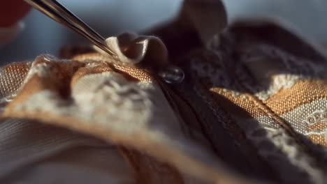 close-up of fabric with lace and a button