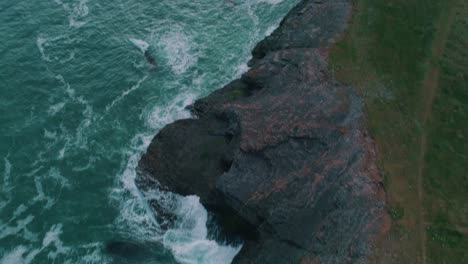 Lighthouse-along-a-cliff-aerial