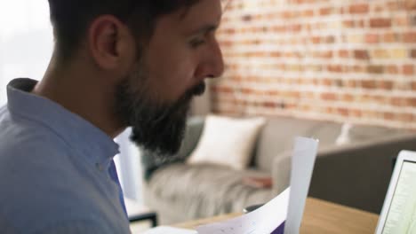 Close-up-video-of-man-analyzing-documents