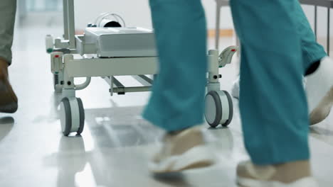 Doctors,-patient-and-push-hospital-bed-to-surgery