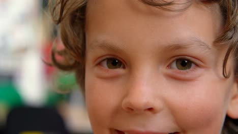 close-up of happy caucasian schoolboy in classroom at school 4k