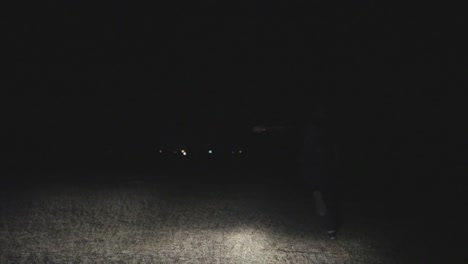 person running at night in a field