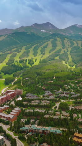 amazing cozy city at the foot of green mountains. picturesque mountains with lots of trails in colorado, usa. vertical video
