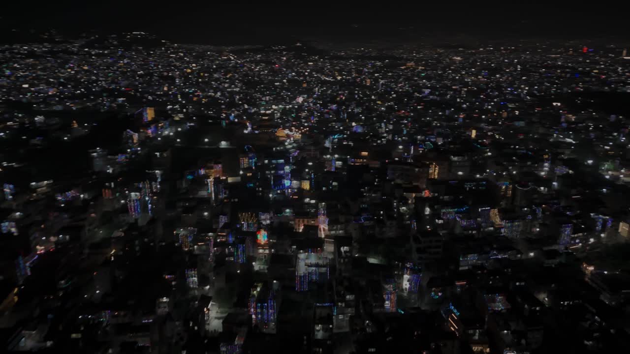 Aerial night drone footage of Kathmandu and Kirtipur during Diwali (Tihar), showing cities illuminated with colorful lights and decorations that reflect Nepal’s joyful culture and festive spirit