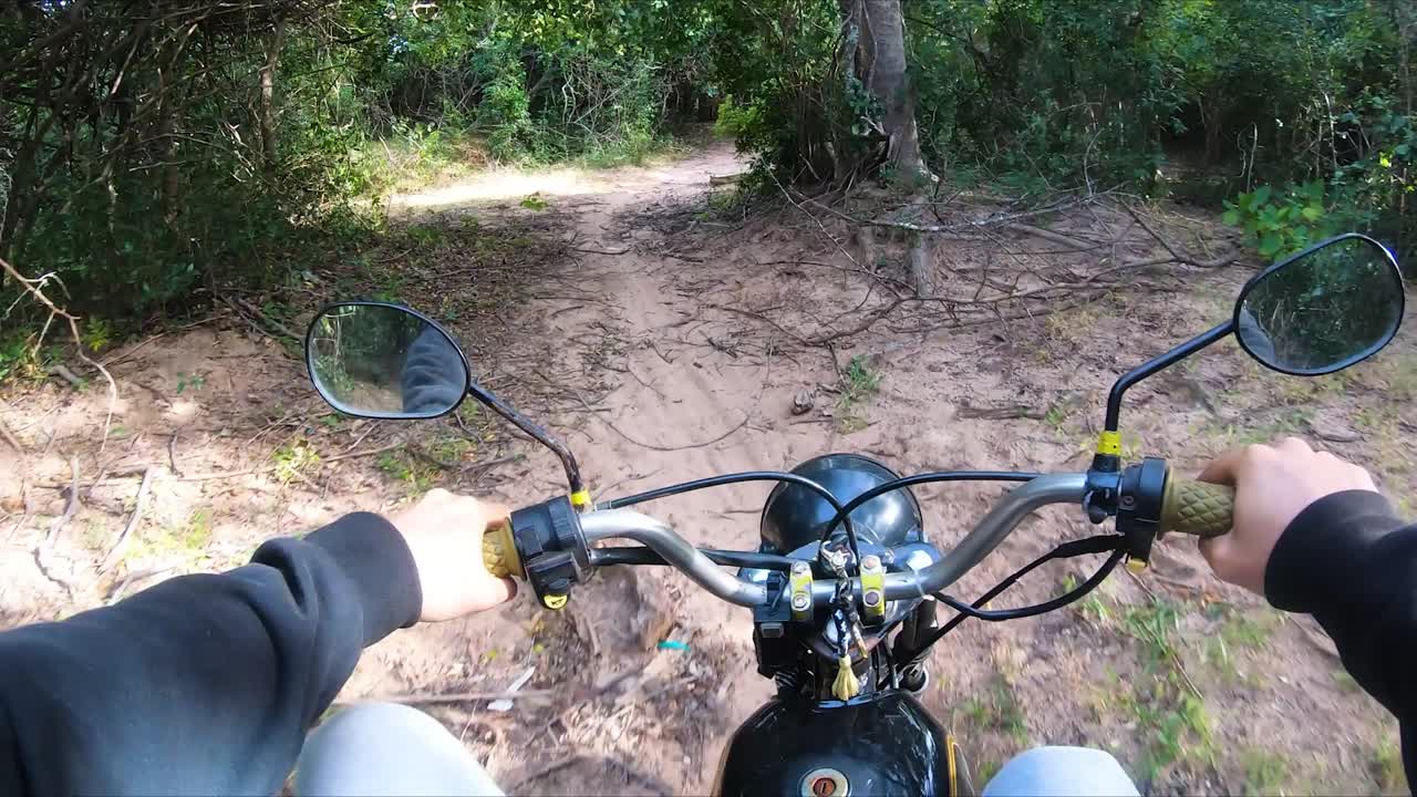 Driving motorbike in jungle of Nui Chua national park, Vietnam. Driver POV