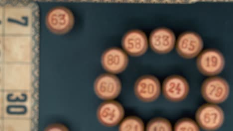 cinematic close-up smooth rotating zoom in shot from above of a bingo wooden barrels in a circle, woody figures, old numbers background, vintage board game, professional lighting, slow motion 4k