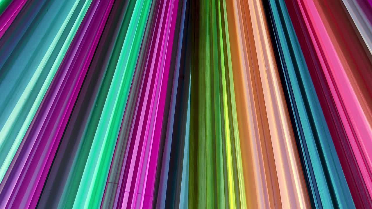 Stock footage of multicolored wedding ceiling drapes creating vibrant, festive ambiance. Ideal for Indian weddings, cultural ceremonies, luxury events or party decor.