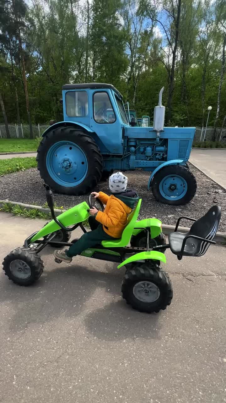 Child riding a pedal kart outdoors