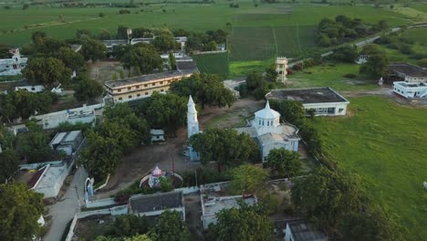 aerial drone footage of a church in a town in india, asia