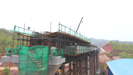 bridge construction site with workers and equipment