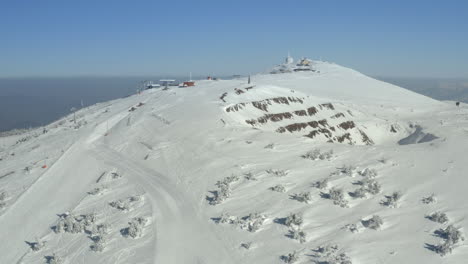 snowy mountain ski resort with clear sky