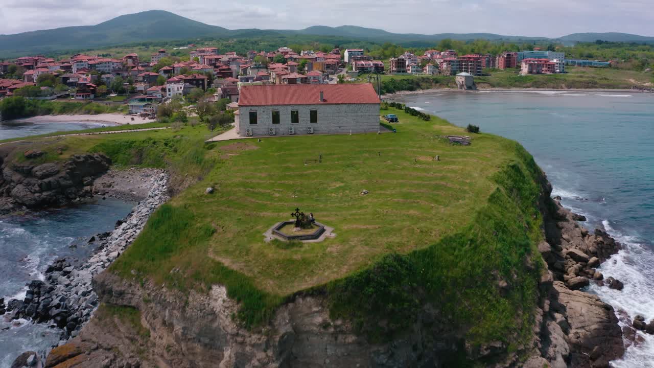 Tsarevo, Church of the Мiraculous success with strong waves hitting the coast