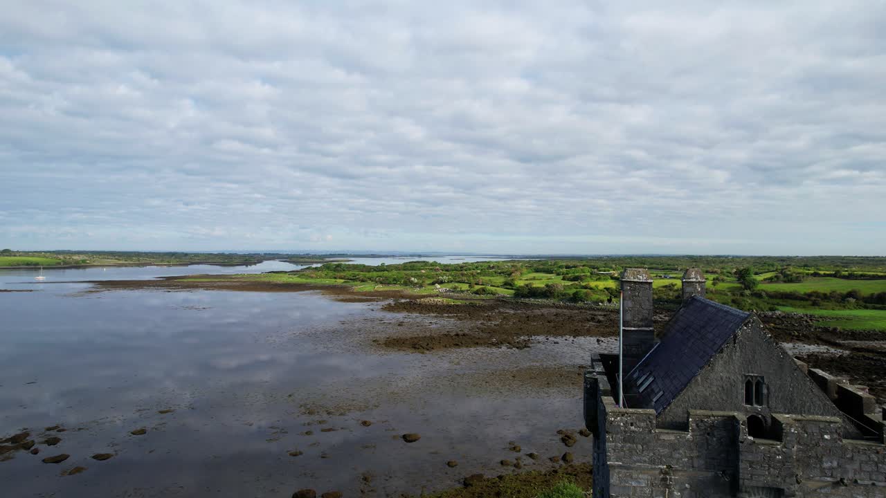 Forward rising shot over Dunguaire Castle in Galway County, Ireland