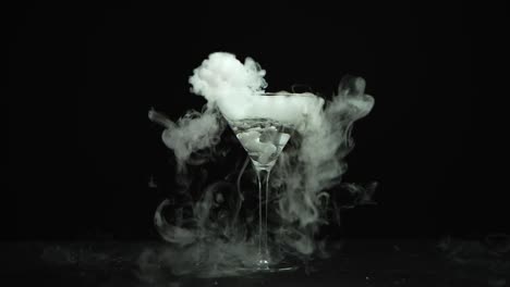 drink in glass of martinis with the effect of dry ice