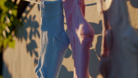 socks and clothes drying on a clothesline